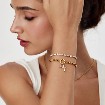 Pulsera de cuentas con cruz de piedra de nacimiento