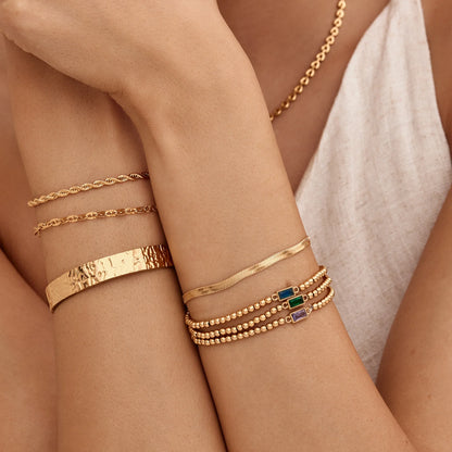 Pulsera de Cuentas Doradas con Piedra Natal en Baño de Oro de 18k — Mujer