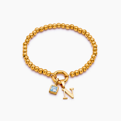 Pulsera de cuentas con inicial y piedra de nacimiento