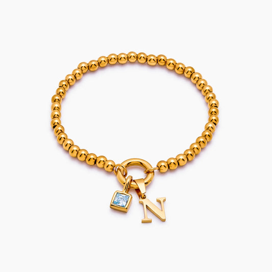 Pulsera de cuentas con inicial y piedra de nacimiento