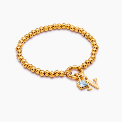 Pulsera de cuentas con inicial y piedra de nacimiento