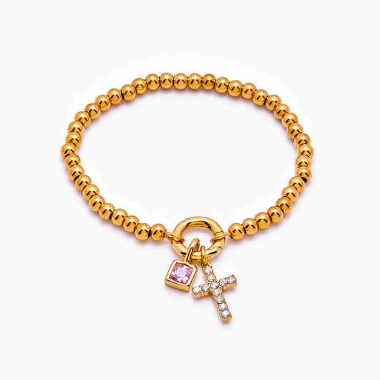 Pulsera de cuentas con cruz de piedra de nacimiento