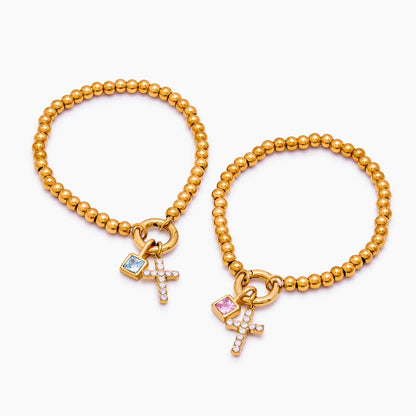 Pulsera de cuentas con cruz de piedra de nacimiento