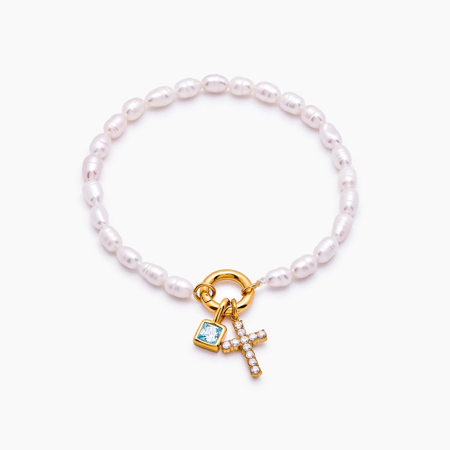 Pulsera con dije de cruz y piedra natal de perla
