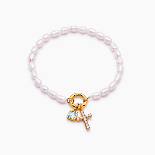Pulsera con dije de cruz y piedra natal de perla