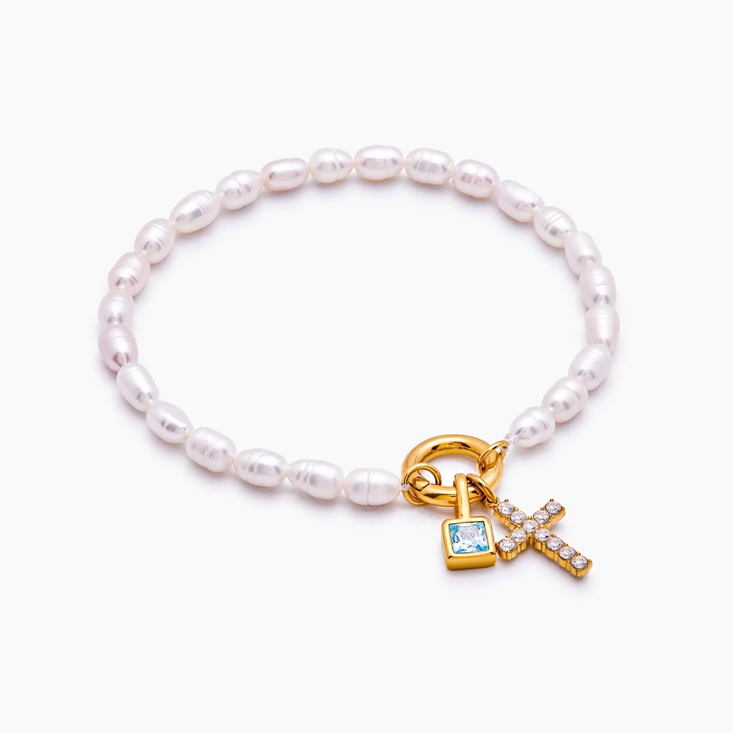 Pulsera con dije de cruz y piedra natal de perla