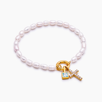 Pulsera con dije de cruz y piedra natal de perla