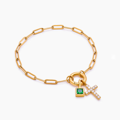 Pulsera con dije de clip y cruz